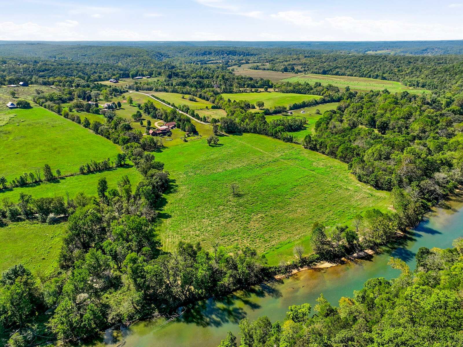 Aerial of the Meramec River bending past the open fields at Meramec Trails