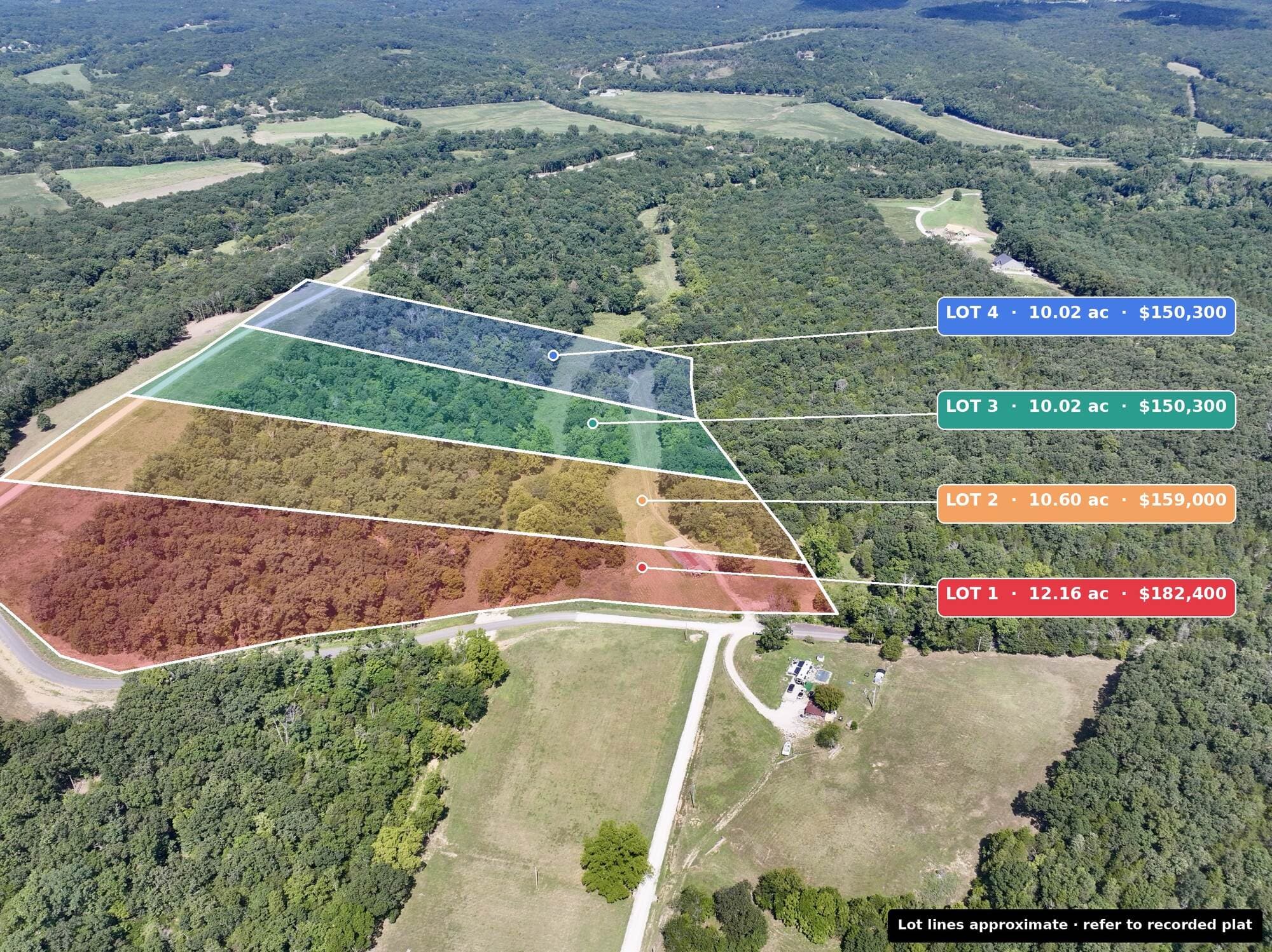 Drone view across the valley showing all four Tanglefoot Farm lots with acreage and prices